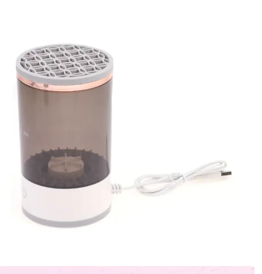 Portable Electric Makeup Brush cleaner with a USB charging cable, designed for efficient brush cleaning.